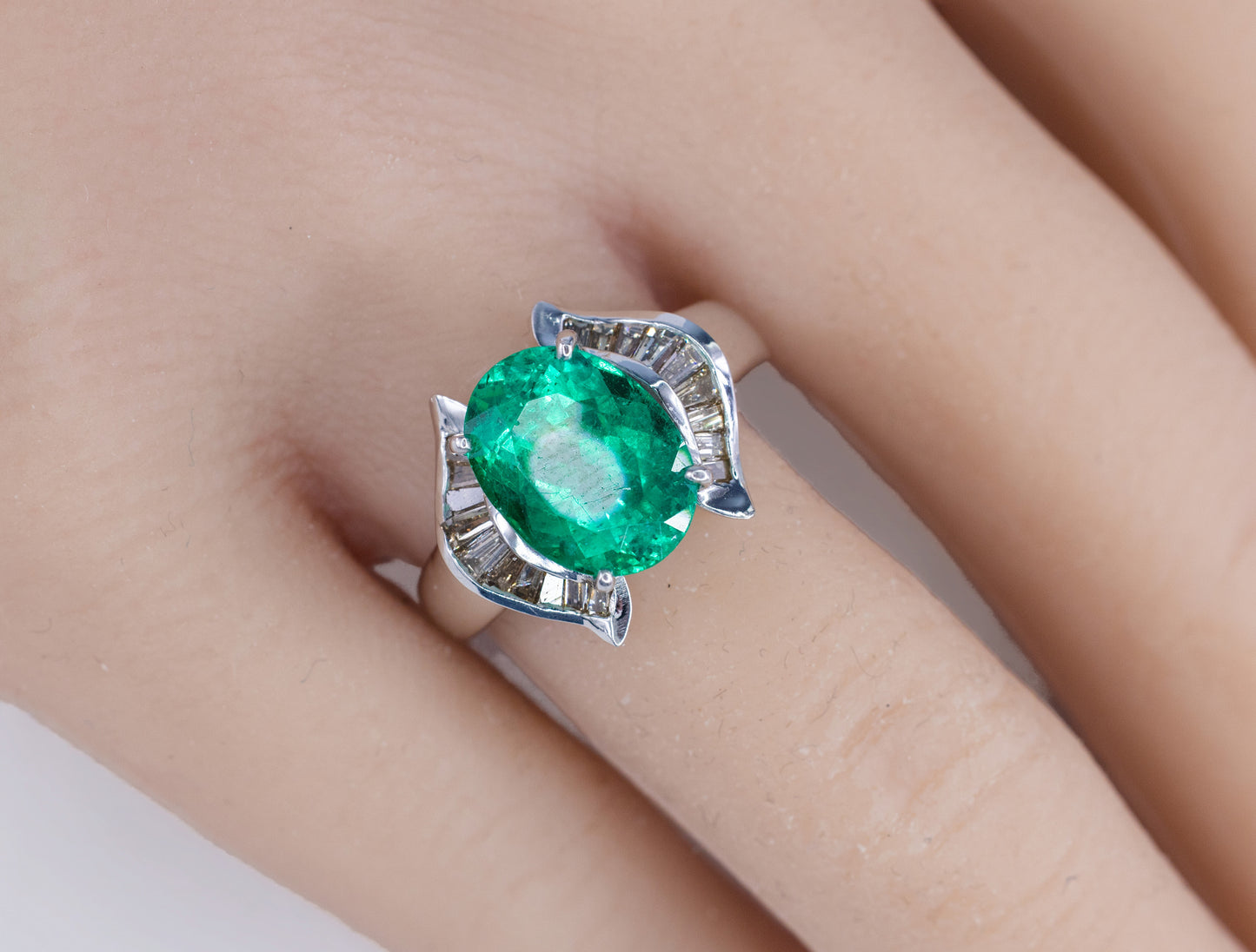 Oval Emerald and Baguette Diamond Horseshoe Bypass Ring