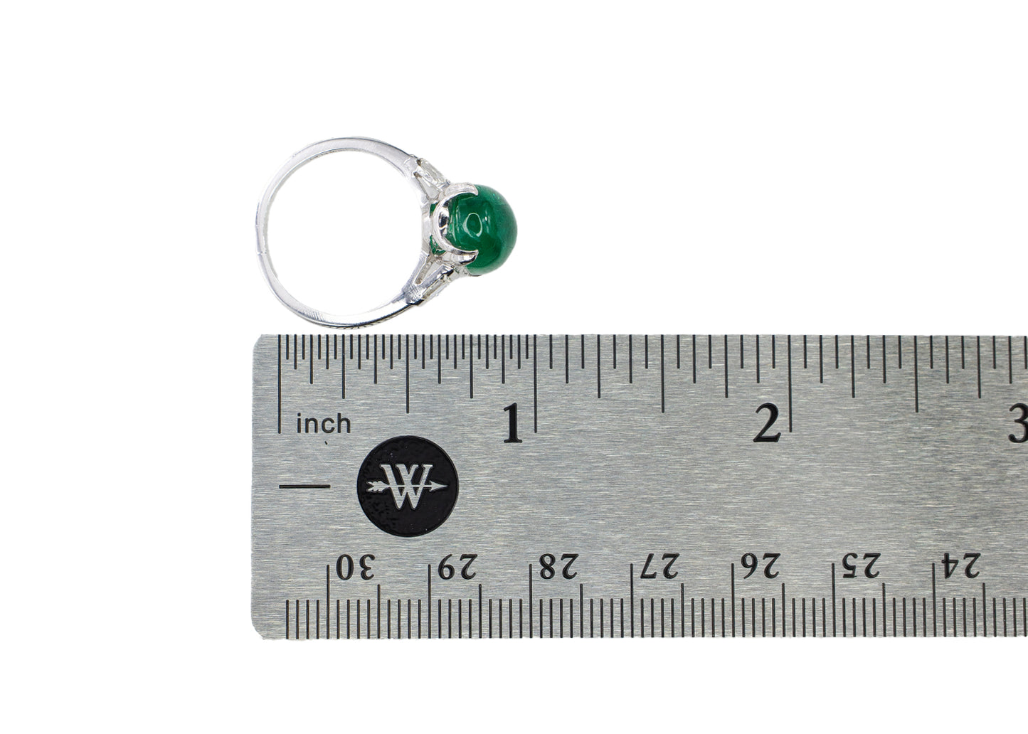 Platinum Oval Cabochon Emerald and Tapered Baguette Diamond Three-Stone Ring