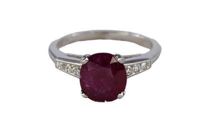 Platinum Oval Ruby Solitaire Ring with Diamond Accents