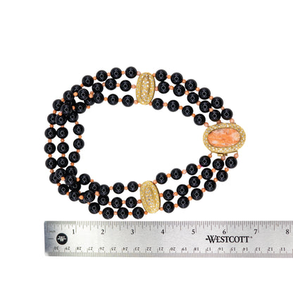 Yellow Gold, Black Onyx, Coral Cameo, and Diamond Three-Strand Statement Necklace