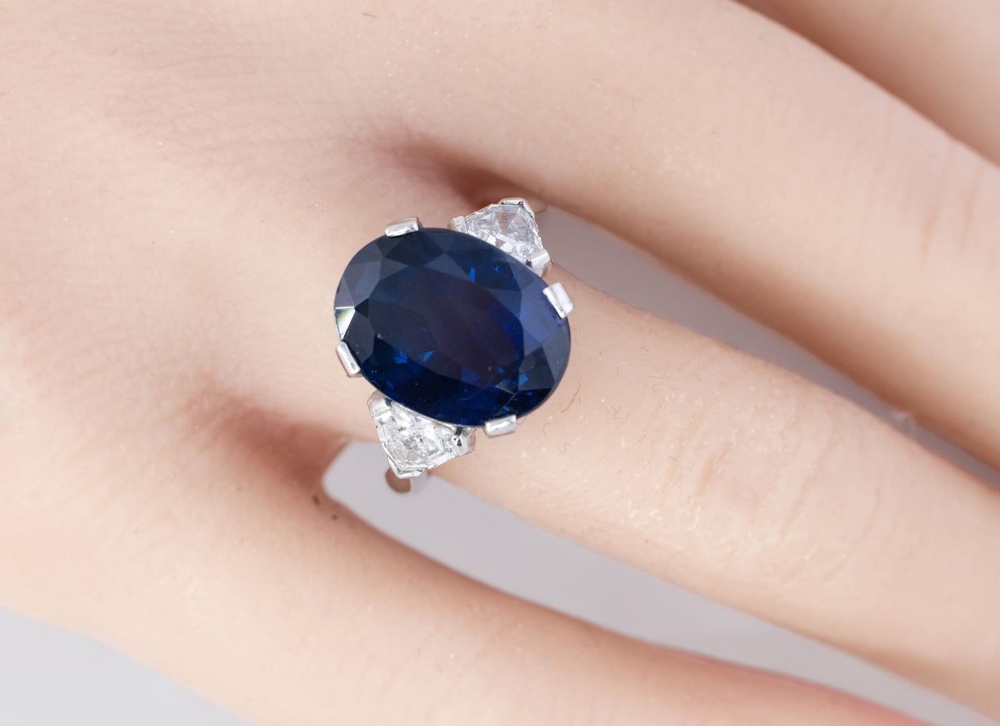 Oval Sapphire and Trillion Diamond Three Stone Platinum Ring