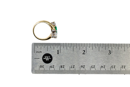 Yellow Gold and Platinum Square-Cut Emerald and Diamond Three-Stone Bypass Ring