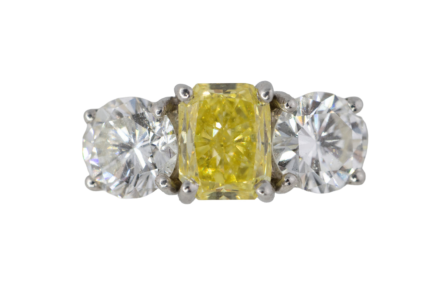 Yellow Radiant Cut Diamond and Round Diamond Three-Stone Platinum