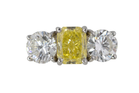 Yellow Radiant Cut Diamond and Round Diamond Three-Stone Platinum