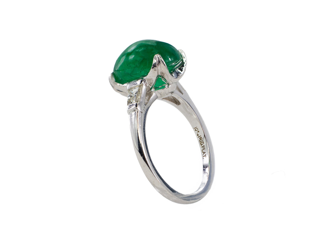 Platinum Oval Cabochon Emerald and Tapered Baguette Diamond Three-Stone Ring