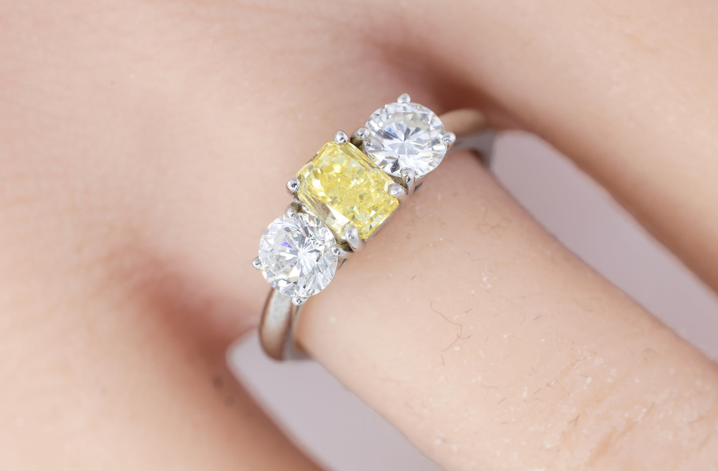 Yellow Radiant Cut Diamond and Round Diamond Three-Stone Platinum