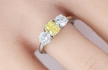Yellow Radiant Cut Diamond and Round Diamond Three-Stone Platinum