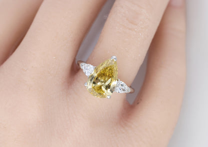 Fancy Yellow Pear Diamond Three-Stone Ring with Pear Diamond Accents