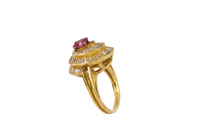 Gold Oval Ruby and Swirling Baguette Diamond Ballerina Ring