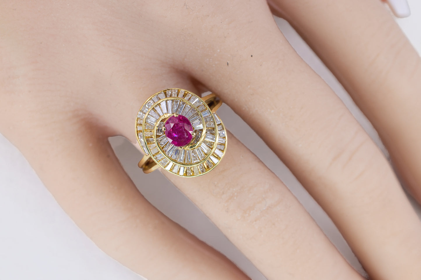 Gold Oval Ruby and Swirling Baguette Diamond Ballerina Ring