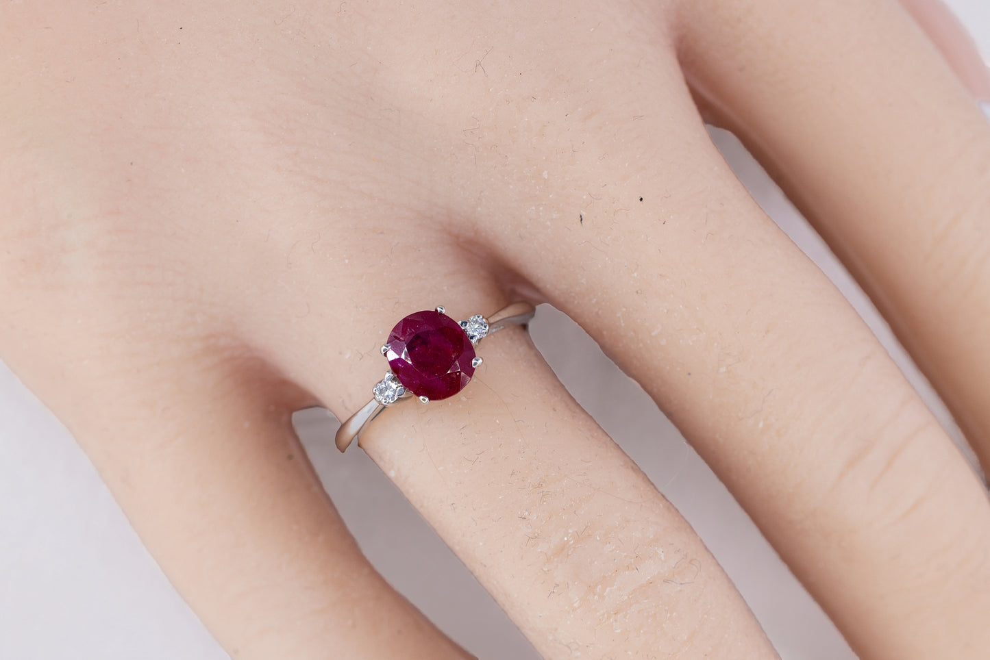 White Gold Oval Ruby Three-Stone Solitaire Ring