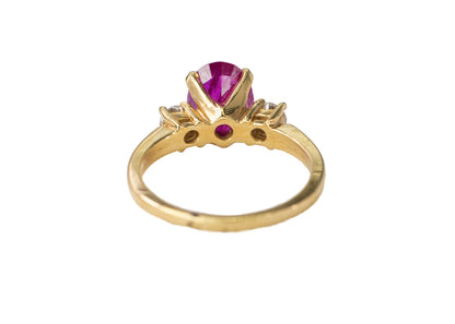 Gold Oval Ruby and Three-Stone Diamond Ring