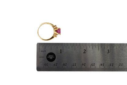 Gold Oval Ruby and Three-Stone Diamond Ring