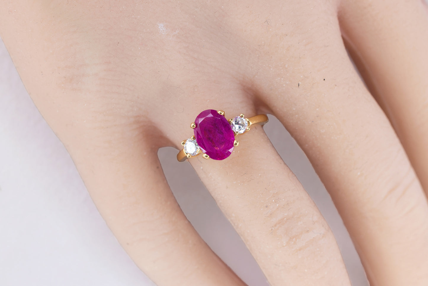 Gold Oval Ruby and Three-Stone Diamond Ring