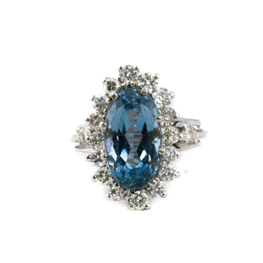 Oval Cut Aquamarine and Brilliant Cut Diamond Halo Ring